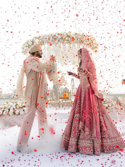 A shower of petals for a lifetime of love. This is the moment I live for, where joy is so pure it fills the entire frame. A perfect blend of grand celebration and intimate connection during the varmala ceremony.