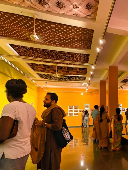 A view of the gallery during the preview of 'No Longer A Memory', showing the unique ceiling treatment with patterned fabric panels.
