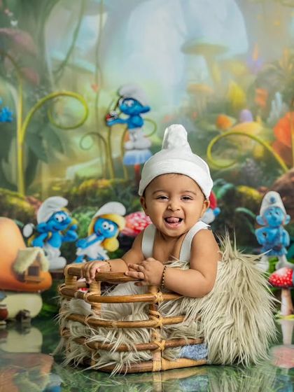 A big, happy grin from the cutest Smurf in the village. His joy is infectious, and we love capturing these happy, candid moments.