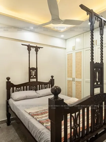 A wide shot of the bedroom from image 192, showing the balance between the traditional bed and the light, modern wardrobe.
