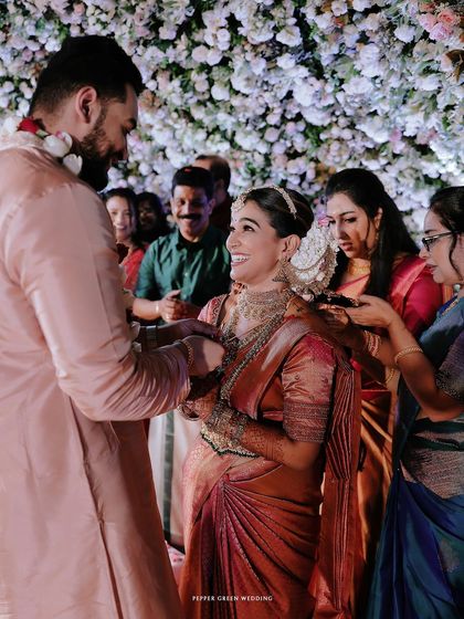 The sacred thali tying ceremony, a moment of deep significance and emotion, surrounded by family.