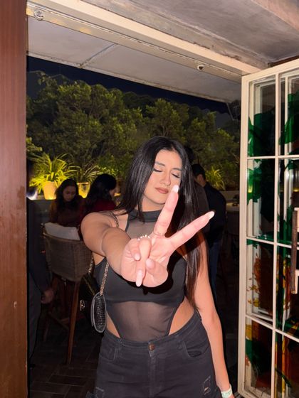 A peace sign to the camera, showing my fun side.