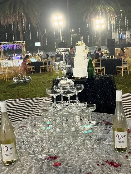 A stunning champagne tower set up for Mohit and Sneha's reception. This is a classic and elegant way to kick off the celebration and create a memorable photo opportunity.
