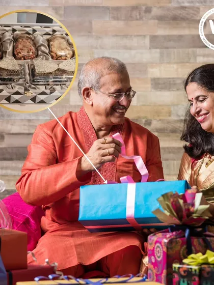 A heartwarming scene of a couple exchanging gifts, with an inset showing the details of my horse-motif hamper. This visual connects my product with the joy of giving and receiving during festive family moments.