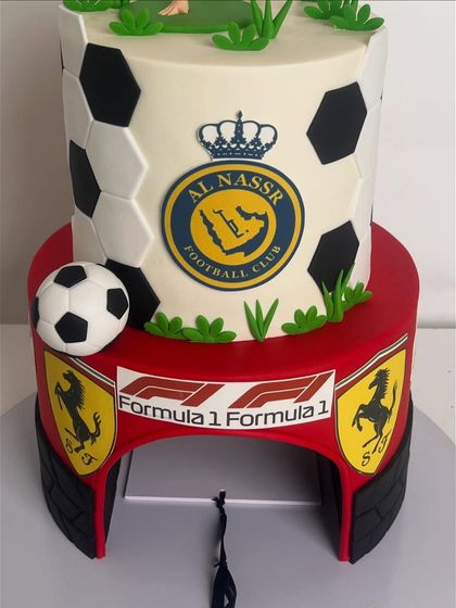 A view of the back of the two-tiered cake, showing the Formula 1 and Ferrari branding on the bottom tier.