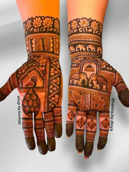 This design uses blocks to feature different traditional motifs, including peacocks and elephants in love. The lotus border at the top adds a touch of elegance.