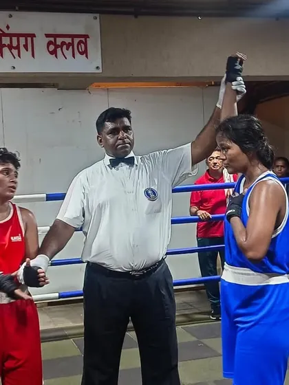 A decisive win for Mary Yadav at the Women's Boxing Tournament we organized. Her hand is raised, confirming her victory in front of a home crowd.