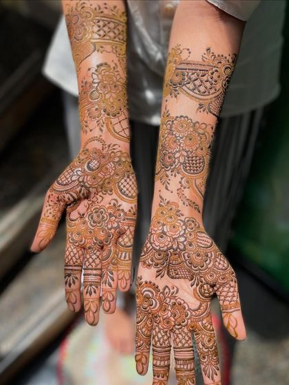Another angle of Heeba's bridal henna, showcasing the consistency and detail in the patterns on both arms.