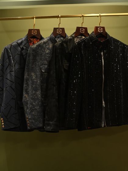 This is not about trends, but about your unique style. A rack of our dark, textured jackets, perfect for evening wear and making a sophisticated statement.