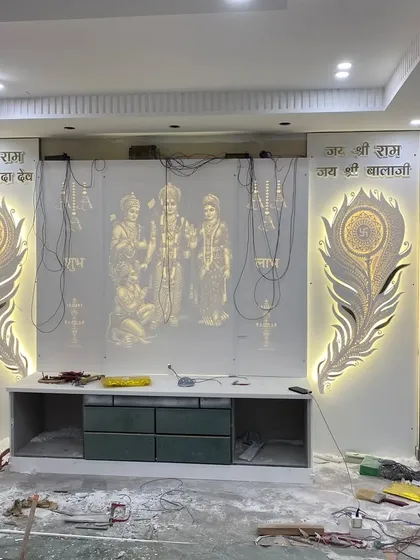 I also create highly personal and custom interior pieces. This mandir or prayer unit was designed exactly to the client's vision, featuring intricate backlit peacock feather designs and a central panel in a premium Korean finish.