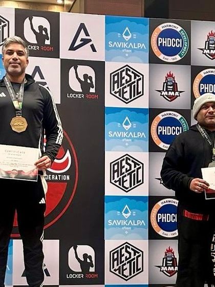 Two of our senior members on the podium, showcasing the depth of talent and experience within our team. Age is just a number on the mats.