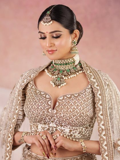 An eyes-closed shot to showcase the precise eye makeup and the flawless, airbrushed finish of the skin.