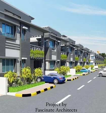 A street-level view within the "Mahavir Nagar" township. This perspective demonstrates the planned urban environment, showcasing the uniform design of the independent homes, roadways, and pedestrian infrastructure.