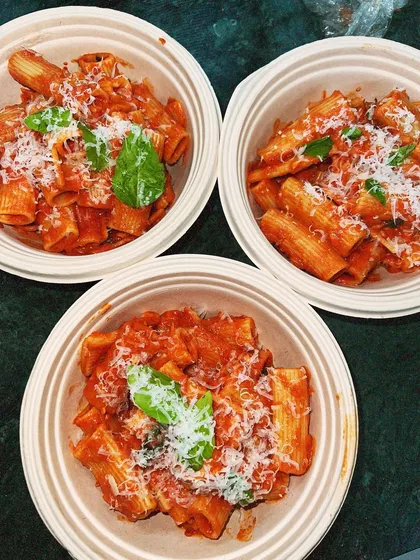 Our Rigatoni Alla Vodka, packed in eco-friendly bowls and topped with fresh parmesan and basil. It's one of our most popular delivery items.