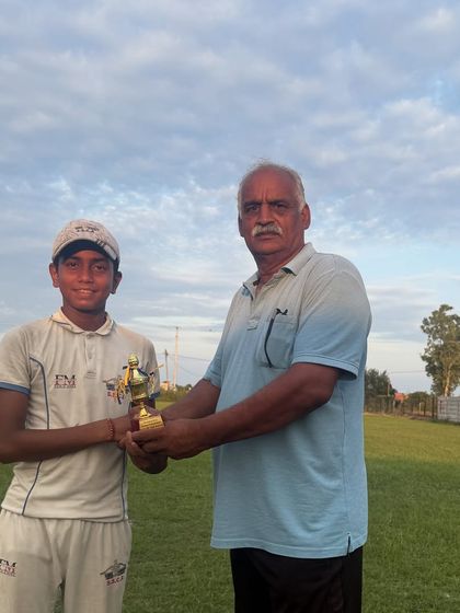Our young champ Divyanshu receiving the best fielder award. We emphasize all three aspects of the game: batting, bowling, and fielding.