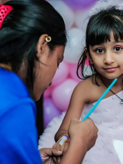 A temporary tattoo station is always a fun addition. A young girl gets a design painted on her arm by one of my team members.