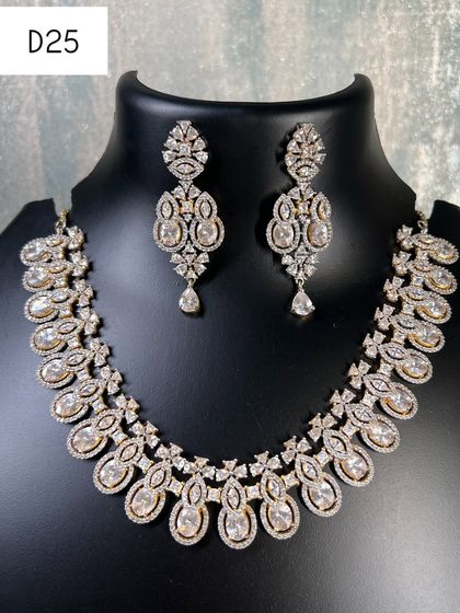 A classic American diamond choker set in a silver and gold dual-tone design. This is a very elegant and versatile piece to rent, perfect for pairing with both traditional and modern outfits.