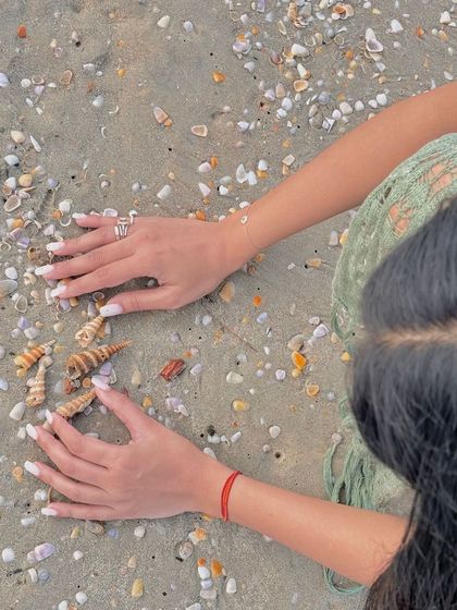 Beach day vibes with a simple and clean white manicure.