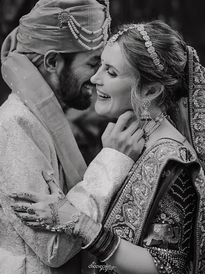 Sometimes, the most powerful moments are the quiet ones. A shared laugh, a knowing glance, captured in classic black and white to feel timeless and true.