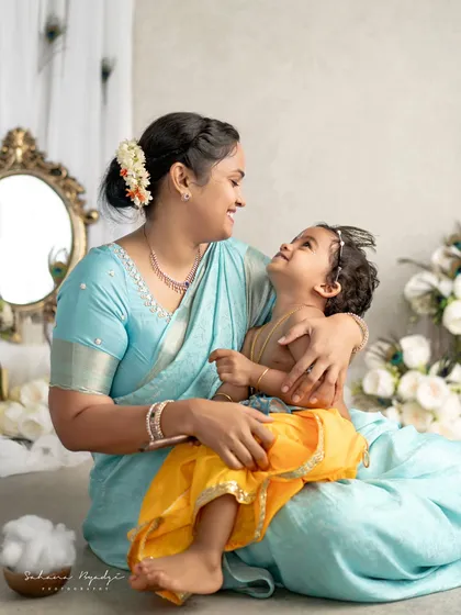 A mother and her little Krishna, sharing a look of pure love and adoration.