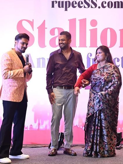 Interacting with senior members of the company on stage. I am comfortable and respectful when engaging with company leadership, ensuring a professional yet warm atmosphere.