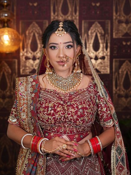 A closer look at the beautiful embroidery on this maroon bridal lehenga. The craftsmanship is what makes these designer pieces so special.