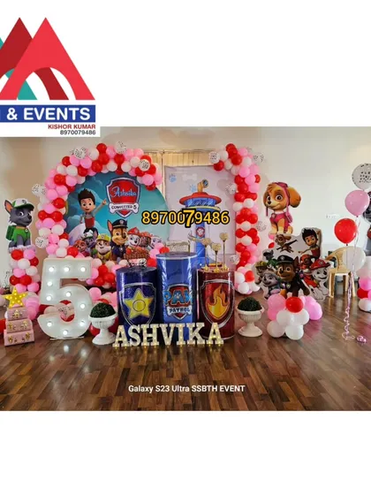 For this 5th birthday, I designed a full Paw Patrol theme. The setup includes character cutouts of the entire pup squad, a large light-up number '5', custom-themed pedestals for the cake, and a vibrant red and pink balloon arch.