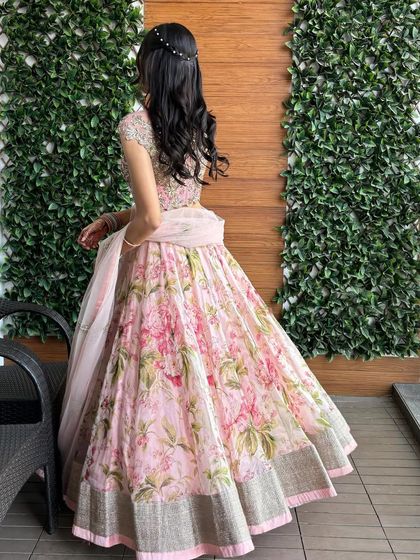 Another look at the playful Anushree Reddy floral lehenga. The back detail is just as beautiful as the front, making it perfect for mehendi or a day wedding.