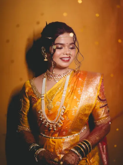 A glowing portrait of the bride, with beautiful lighting enhancing her dewy makeup.
