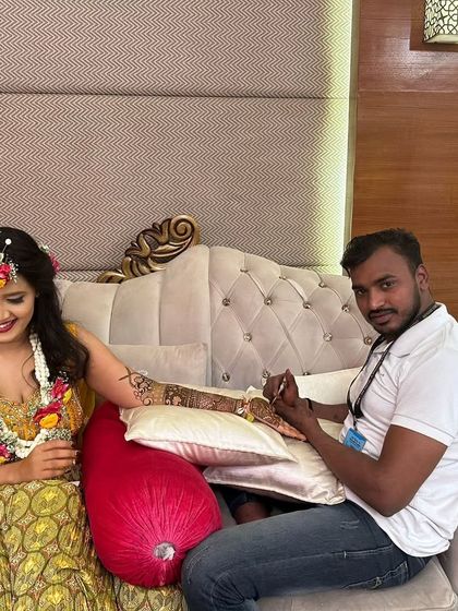 Posing with a client after completing her beautiful arm mehndi. Seeing my clients happy with their designs is the most rewarding part of my job.