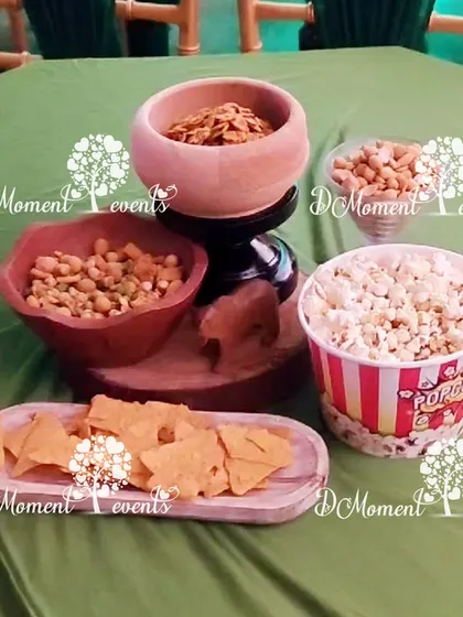 I take care of the snacks too. Here's a simple yet appealing spread of popcorn, nachos, and other munchies for guests to enjoy.