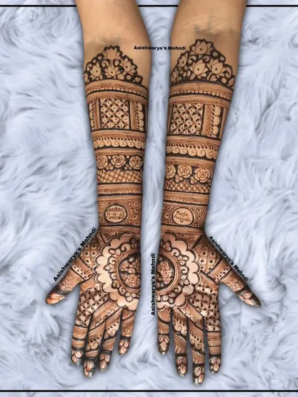 A stunning engagement bridal design with matching mandala patterns on both palms. The arms are filled with detailed geometric and floral bands.