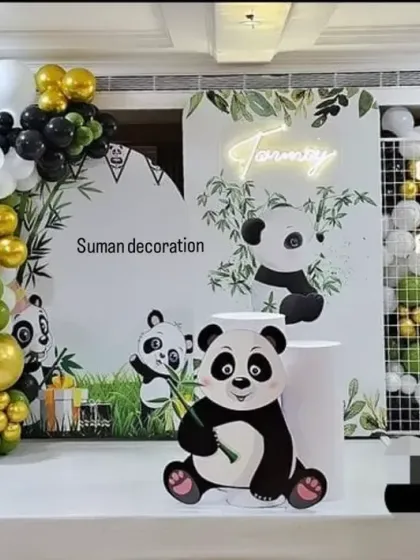 A cute and unique panda-themed first birthday party. I used a black, white, and green color scheme, panda cutouts, and a bamboo-style backdrop to create this adorable setup.