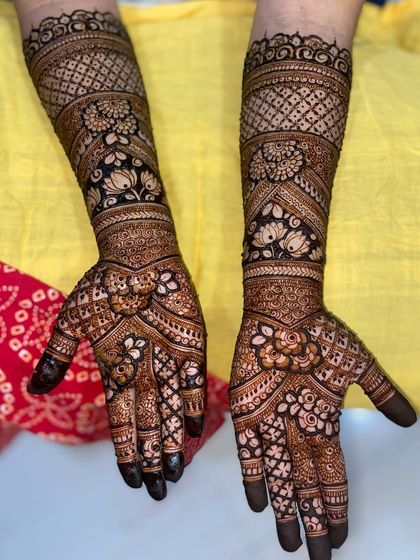 The same intricate floral design, showing the beautiful contrast of the dark henna against the skin.