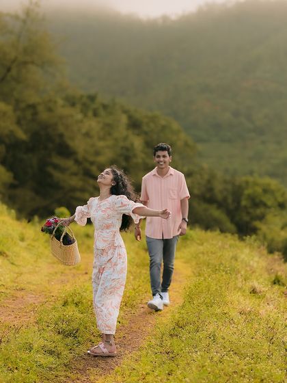 A moment of pure freedom and happiness, with her arms outstretched. This candid shot perfectly captures the feeling of being on top of the world.