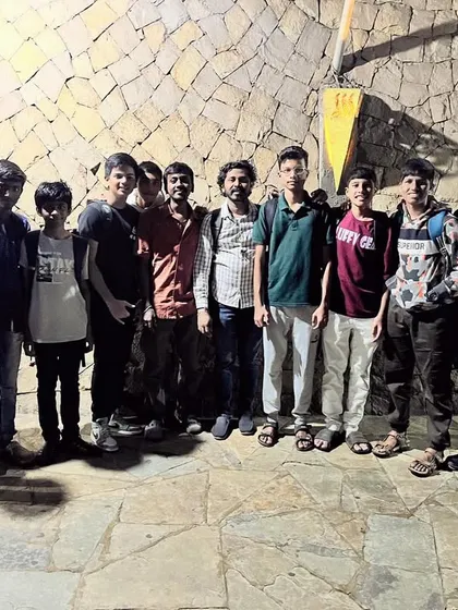 A group of our male students and teachers posing for a photo during the 2023 annual picnic.