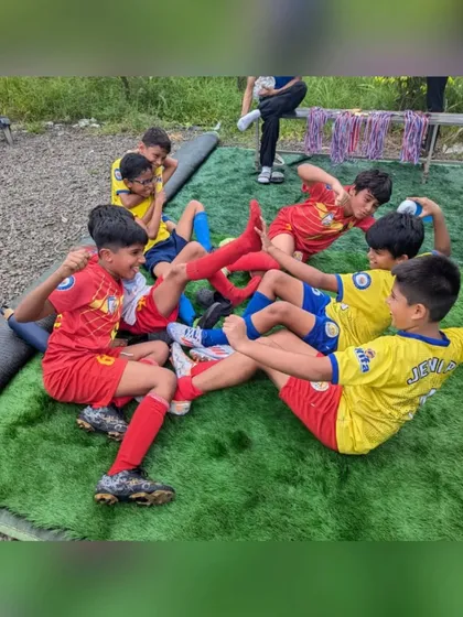 A playful moment of celebration from our U11 champions after their tournament victory.