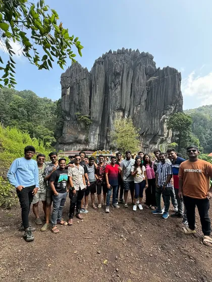 Our group posing in front of the unique rock formations at Yana caves, often part of our Gokarna trips.