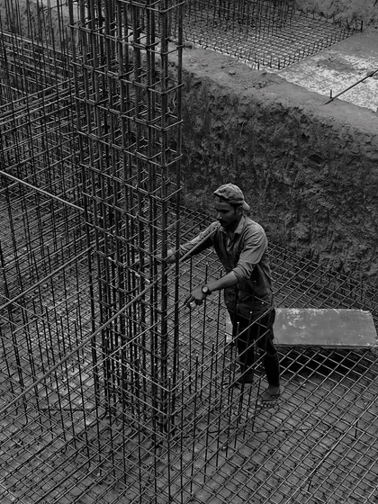 Our turnkey design and build process starts from the ground up. This image captures the foundational stage, where the steel framework of a building begins to take shape, representing the strength and precision that underpins every one of our projects.