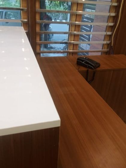 A view of a newly installed 24-extension EPABX intercom system at a client's office, with handsets placed on the reception counter.