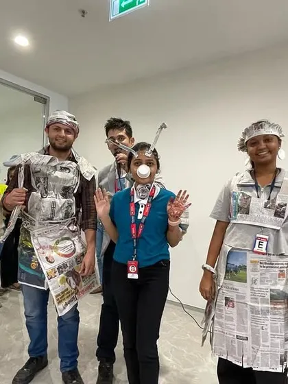 Another creative team from the newspaper fashion show. It is amazing to see what people can come up with using just newspapers and tape. This is a great activity for fostering creativity.