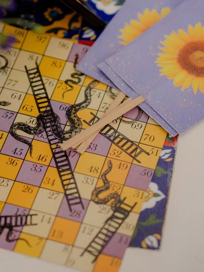 Even the smallest details are an opportunity for creativity. We designed custom Snakes and Ladders game boards for guests to play, adding a touch of nostalgic fun to the Haldi event.