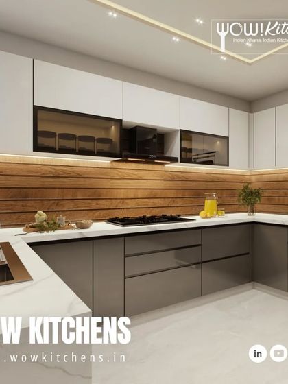 This angle highlights the seamless sink and countertop area, along with the smoked glass upper cabinets that add depth and display space without creating clutter.