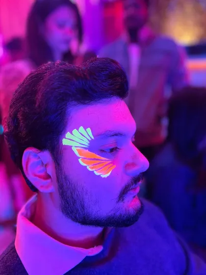 Neon angel wings! This is a fun and popular design that looks great on everyone. The orange and yellow combo is super vibrant.