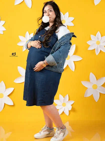 A fun and quirky solo shot with a bubblegum pop. This shows that maternity photos can be playful and reflect your unique personality.