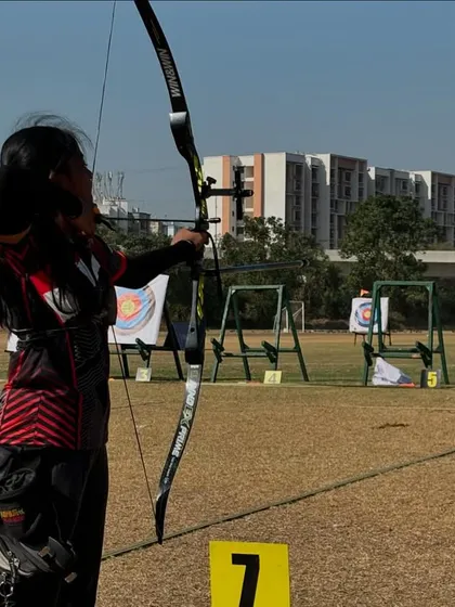 A student takes aim with her recurve bow during the SFA Archery Championships in Mumbai, where our archers won 5 medals.
