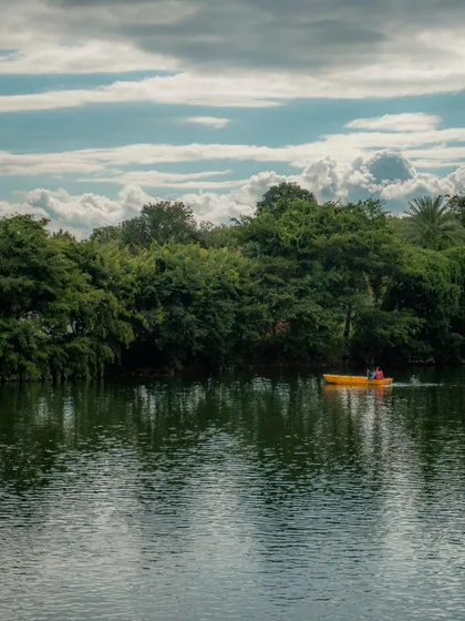 A lone boat on the vast lake, capturing the scale and serenity of the water body at Area 83.