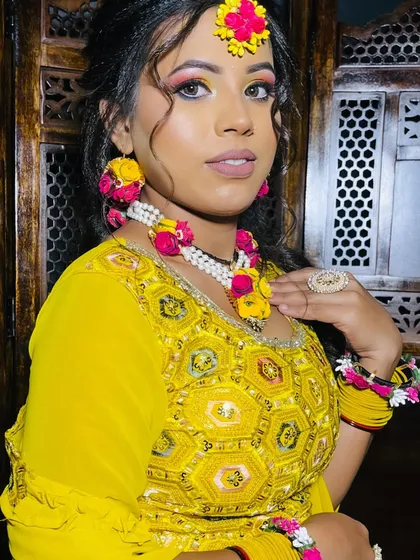 A close-up of the Haldi bride, showcasing the fresh and glowing makeup perfect for a daytime event.