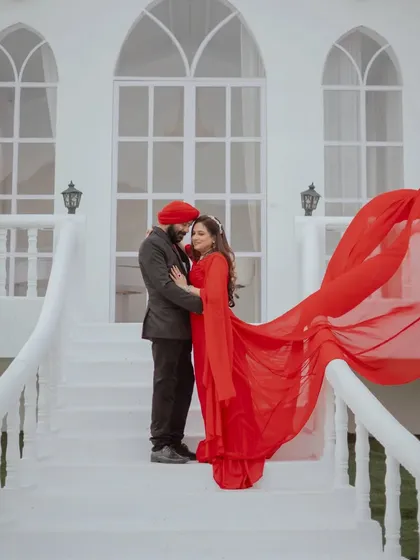 A stunning anniversary portrait with a flowing red gown. It proves that you don't need a wedding to have a glamorous and romantic photoshoot to celebrate your love.