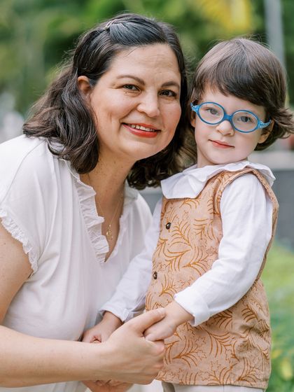 A mother and son portrait. His glasses and her smile make this a charming and personal photo.